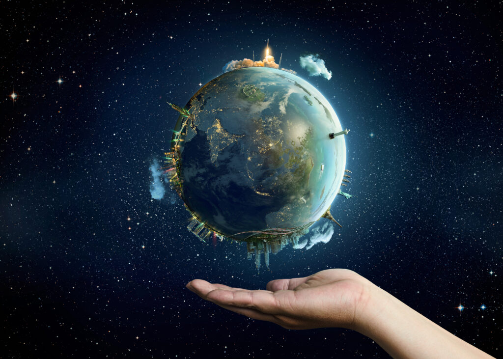 A human hand holding a planet.